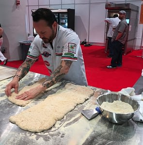Tony Gemignani works the dough at Pizza Expo
